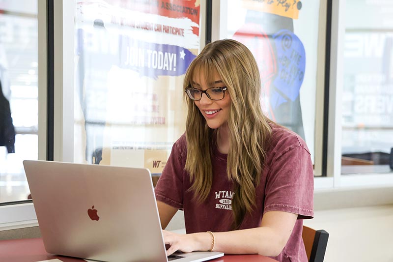 WT Student with Laptop