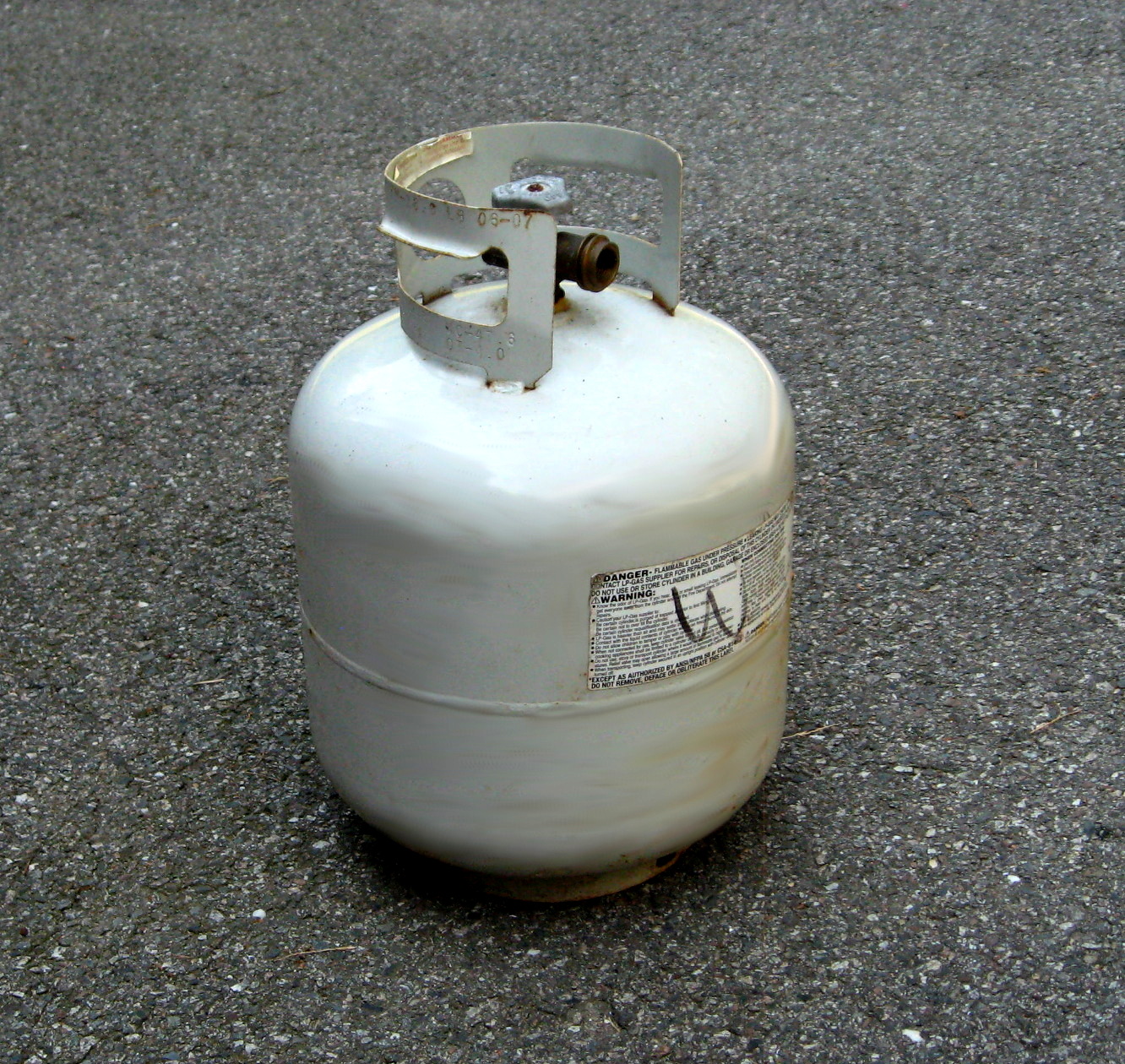 Why is propane stored in household tanks but natural gas is not