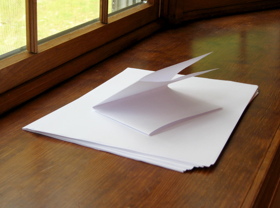 What stops a piece of paper from being folded more than seven times?