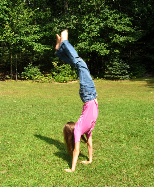 girl doing handstand